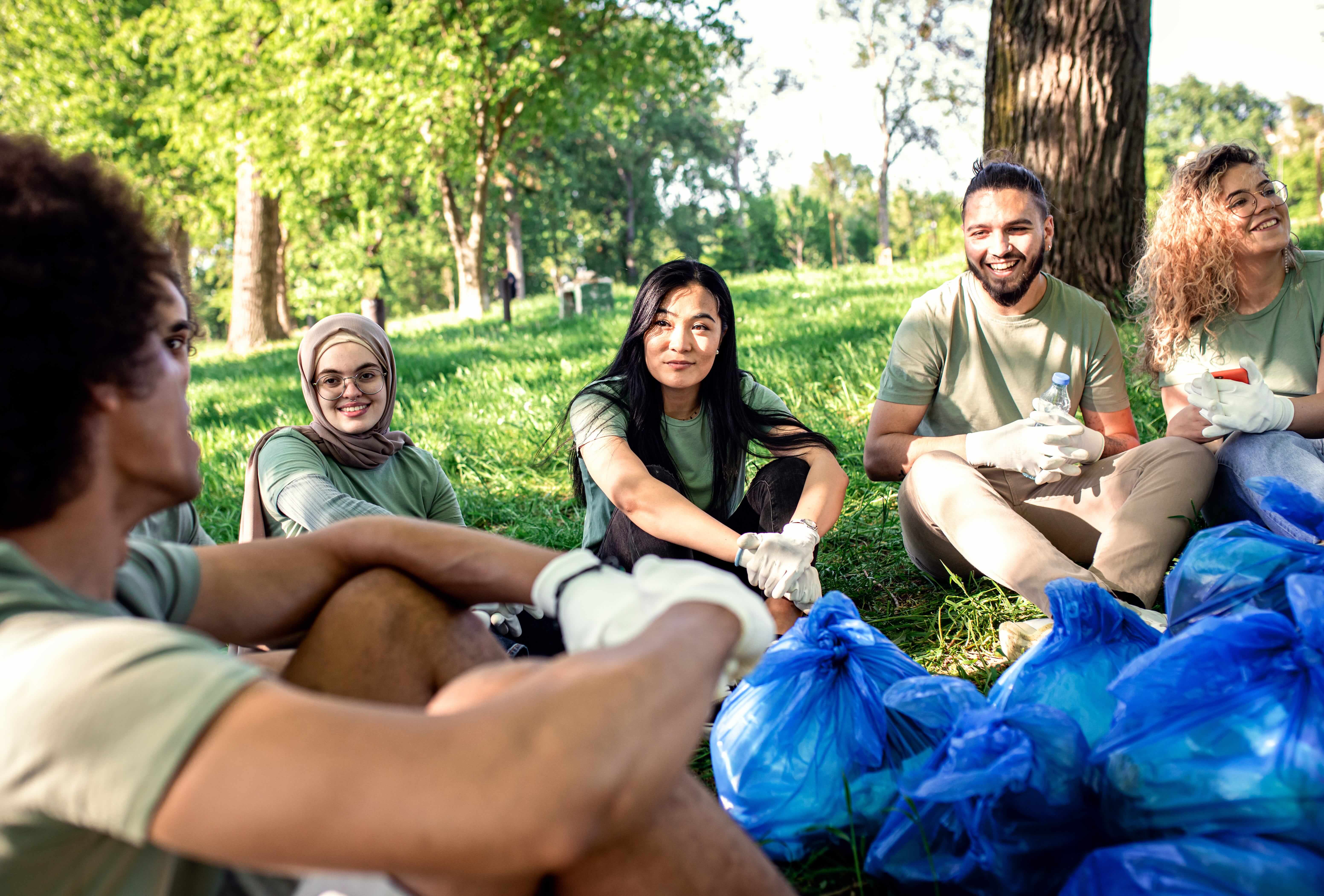 Group of people sitting under tree
