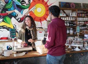 Image of cashier and buyer at Acton Co-op