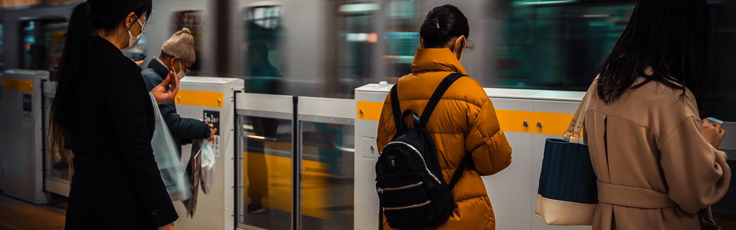 Image of travellers at train station transfer