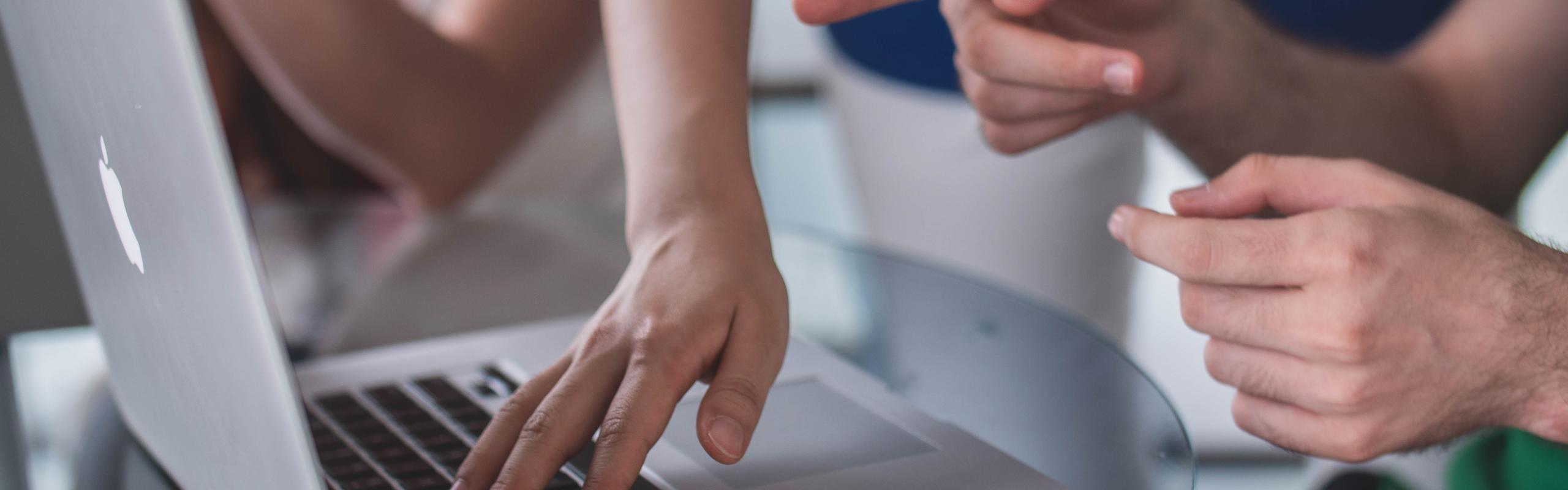 Person showing laptop user item on screen