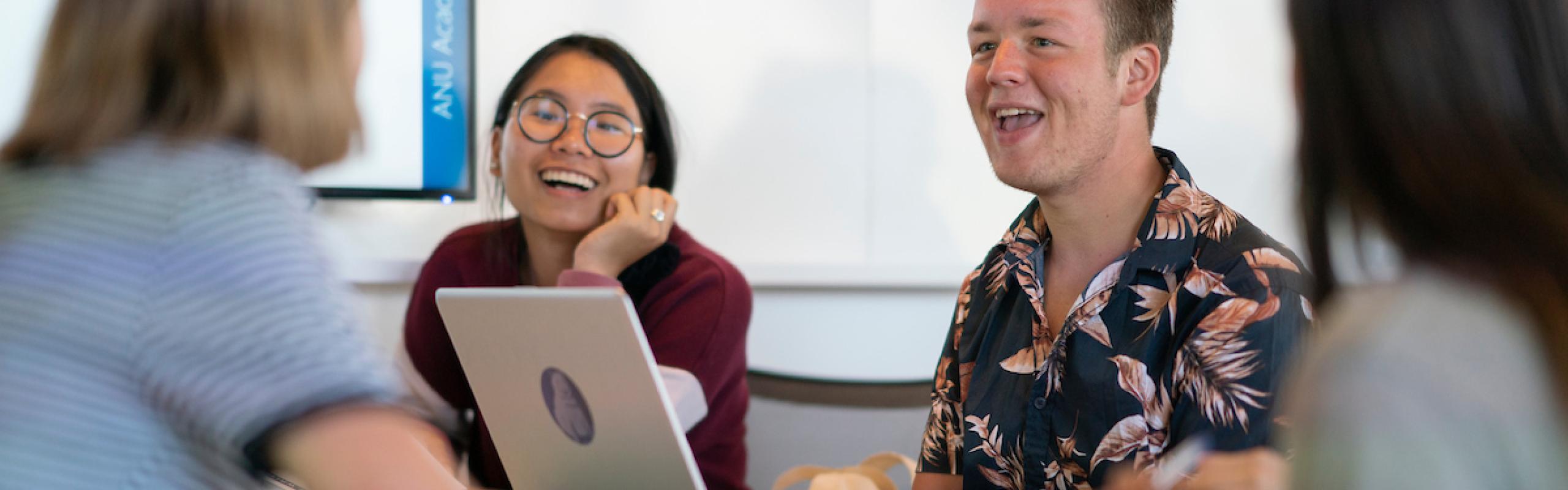 Image of four students at desk